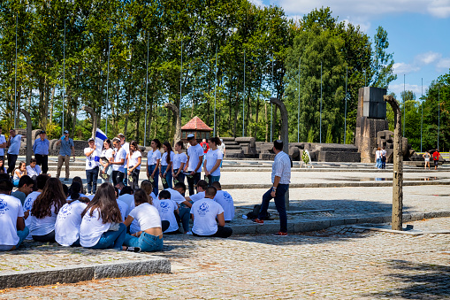 Auschwitz - Birkenau, Poland - August 11, 2019:A group of Jewish youth group visit the Auschwitz - Birkenau concentration camp, Poland