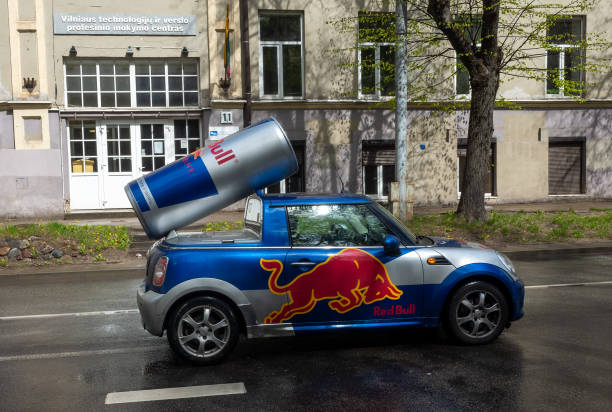 Sights of the Lithuanian capital April 27, 2018 Vilnius, Lithuania, Car Mini Cooper painted in the symbolism of the company Red Bull on one of the streets in Vilnius. red bull mini stock pictures, royalty-free photos & images