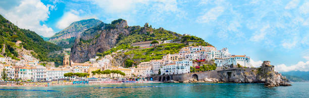 Panoramic view, aerial skyline of small haven of Amalfi village with tiny beach and colorful houses, located on rock, Amalfi coast, Salerno, Campania, Italy Panoramic view, aerial skyline of small haven of Amalfi village with tiny beach and colorful houses, located on rock, Amalfi coast, Salerno, Campania, Italy sorrento italy photos stock pictures, royalty-free photos & images