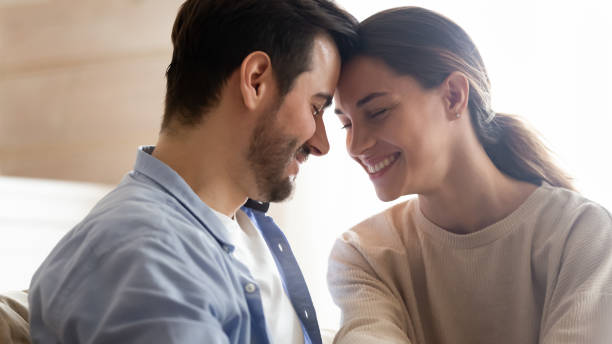 istock Happy young couple hug enjoying romance at home 1207692016