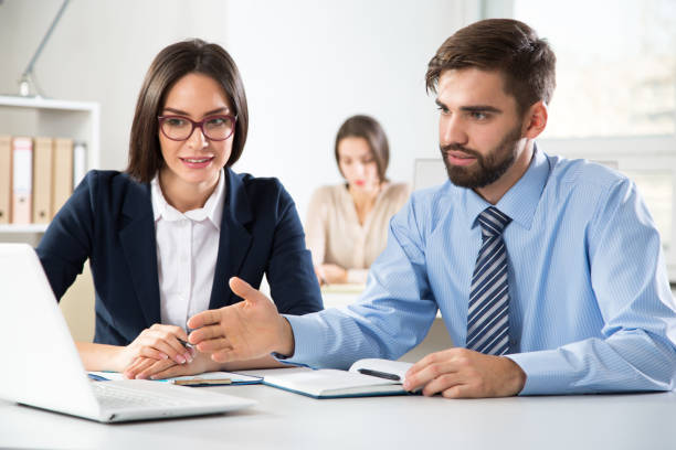 istock Businessman tells his colleagues about a new project 1207698775