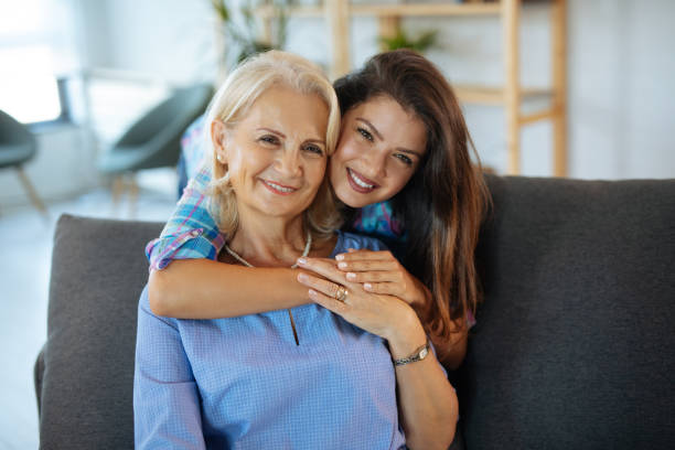istock Young woman hugging her mother with love 1207699370
