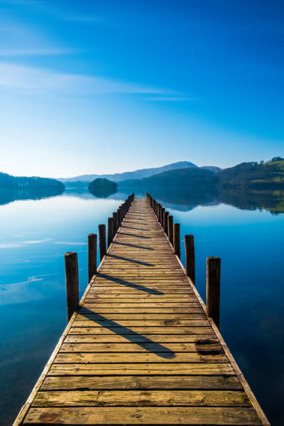 Landing Stage on Coniston Water, English Lake District, Cumbria, UK Wooden landing stage on Coniston Water. jetty stock pictures, royalty-free photos & images