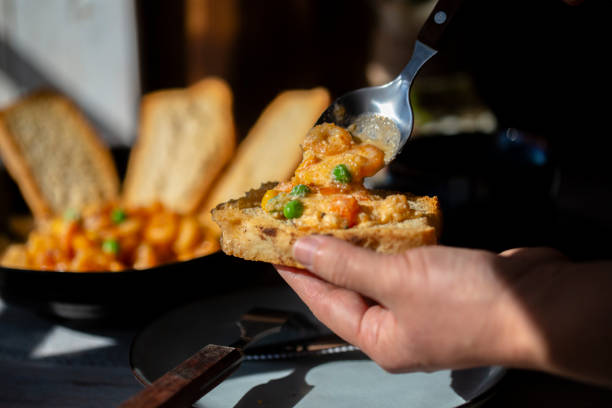 istock homemade breakfast: toasted bread slices,  dipping in prawn cream sauce 1207706161