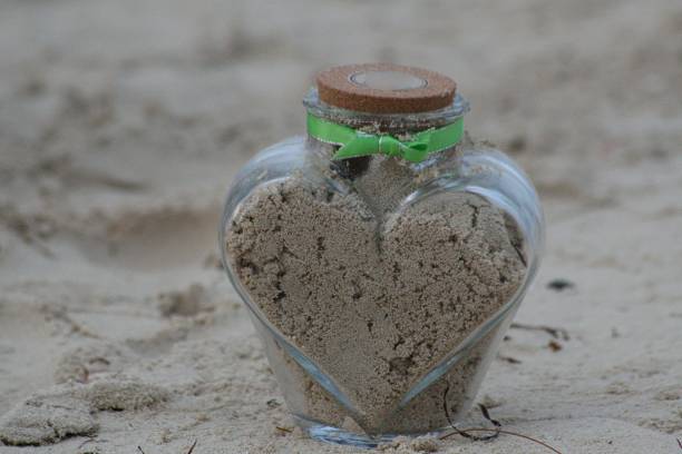 Sand in a heart-shaped bottle, wedding accessories for time capsule