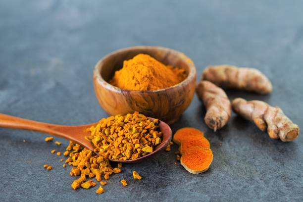 istock Turmeric powder and turmeric roots 1207707662