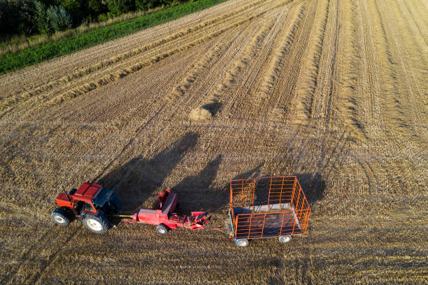 istock Tractor Baling and Collecting Hay Bales, Aerial View 1207708268
