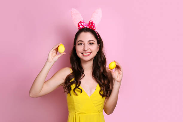 istock Joyful female posing for easter themed photoshoot with bunny ears. 1207708594