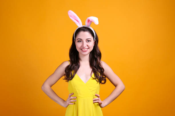 istock Joyful female posing for easter themed photoshoot with bunny ears. 1207708847