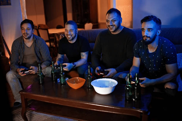 istock Friends playing games and eating snacks 1207708852