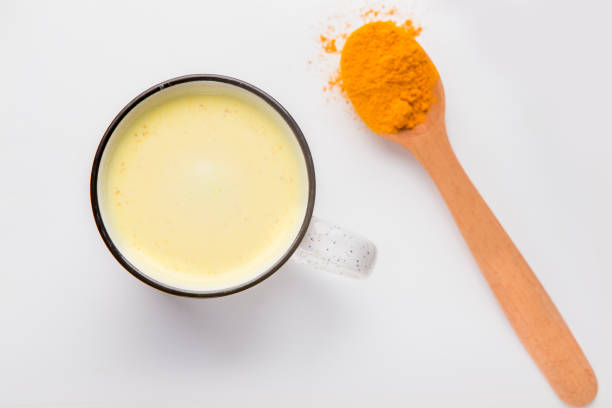 istock Healthy ingredients for making turmeric milk with powder 1207713199