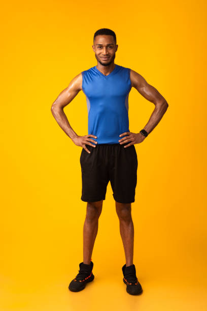 istock Full length image of smiling happy afro guy 1207713805
