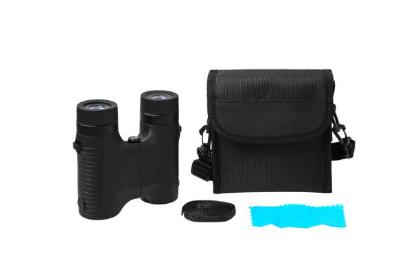 istock Modern binoculars isolated on white background. Black binoculars and a soft case to it on a light background. 1207714446