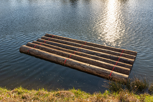 little raft on a idyllic lake in the sunshine