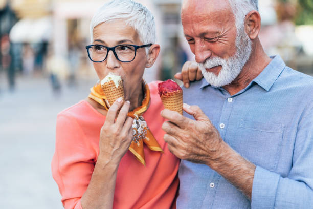 istock Happy senior couple eating ice cream 1207715732