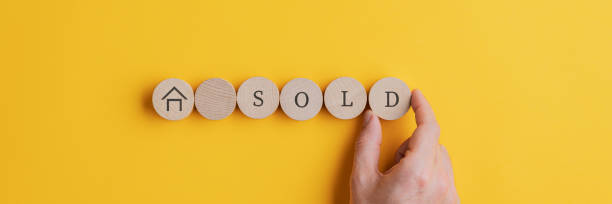 istock Hand drawn house shape and SOLD sign 1207718402