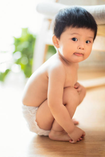 Lovely baby Lovely baby baby squatting stock pictures, royalty-free photos & images