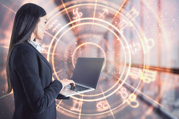 Teamwork and astrology concept Attractive young european businesswoman with laptop and abstract zodiac sign hologram on blurry office interior background. Technology and astrology concept. Double exposure gemini astrology sign photos stock pictures, royalty-free photos & images