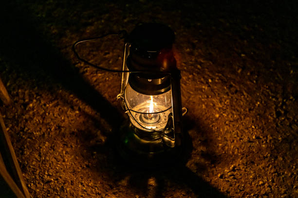 istock An old fashioned oil lamp illuminating a garden path at night 1207721523