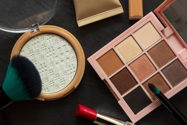 istock Set of decorative cosmetics, makeup tools and accessories on black slate background. Copy space. Flat lay. Top view. Skin care or morning routine concept 1207721822