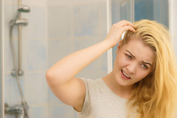 istock Female having problem with blonde hair 1207722527