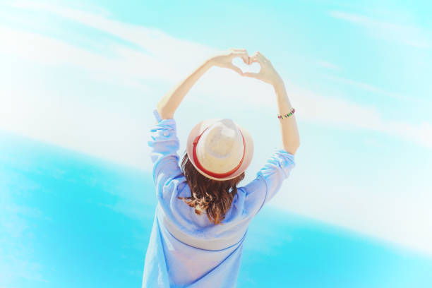 Woman in summertime with tropical ocean scenery.