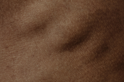 Ribs. Detailed texture of human skin. Close up shot of young african-american male body. Skincare, bodycare, healthcare, hygiene and medicine concept. Looks beauty and well-kept. Dermatology.