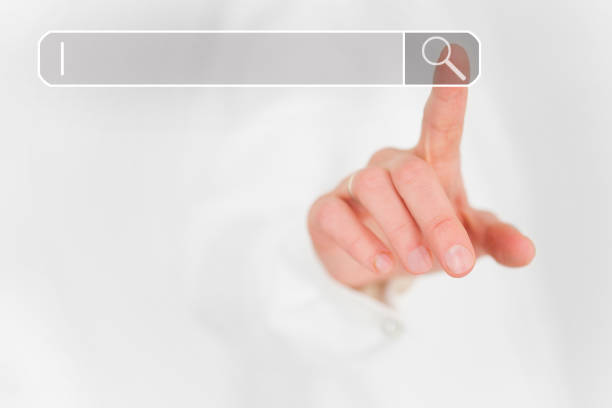 istock Index finger of a hand points to the search field 1207724328