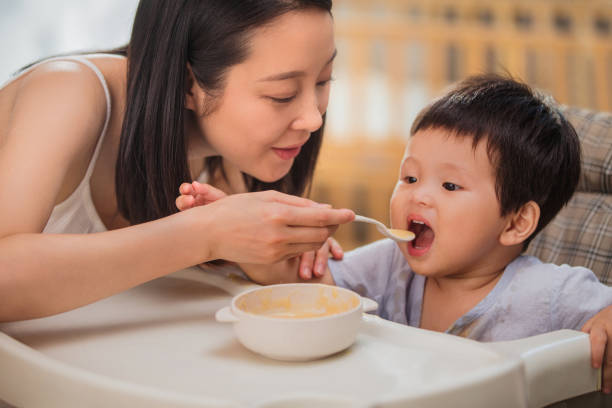 istock Mother to feed the baby 1207726166