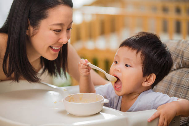 istock Mother to feed the baby 1207726178
