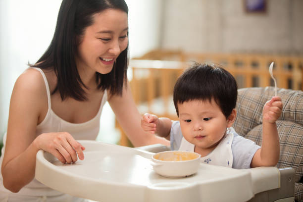 istock Mother to feed the baby 1207726257