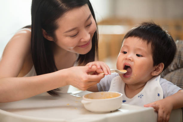 istock Mother to feed the baby 1207726283