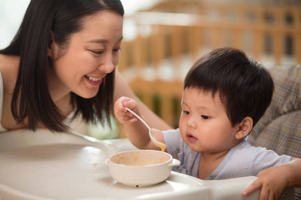 istock Mother to feed the baby 1207726290