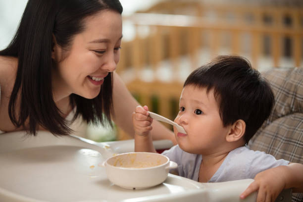 istock Mother to feed the baby 1207726432