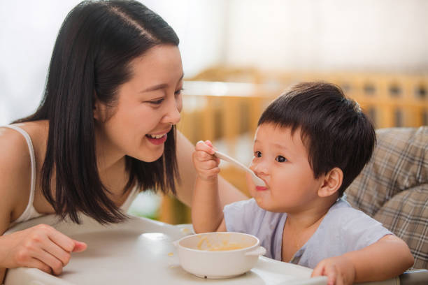 istock Mother to feed the baby 1207726464