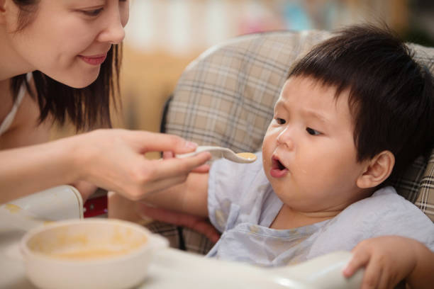 istock Mother to feed the baby 1207726513