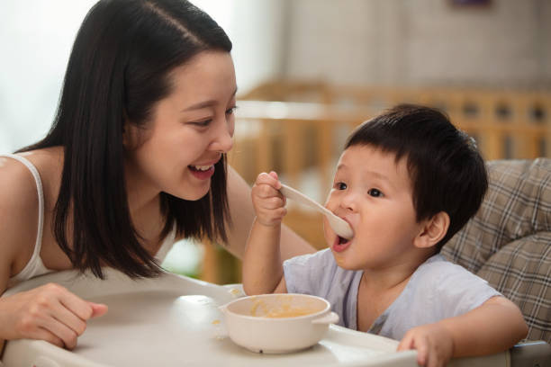 istock Mother to feed the baby 1207726530