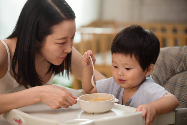 istock Mother to feed the baby 1207726645