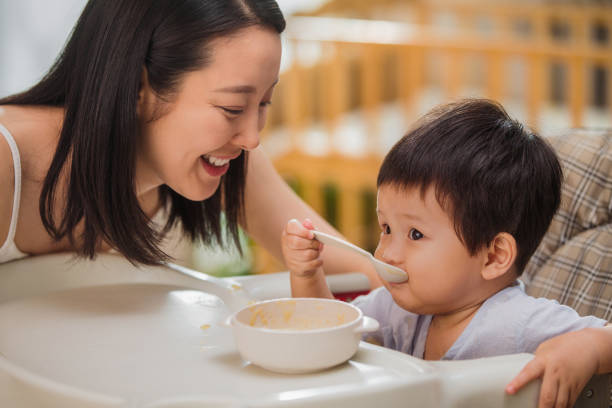 istock Mother to feed the baby 1207726659