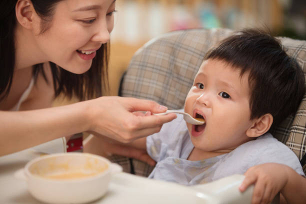 istock Mother to feed the baby 1207726670