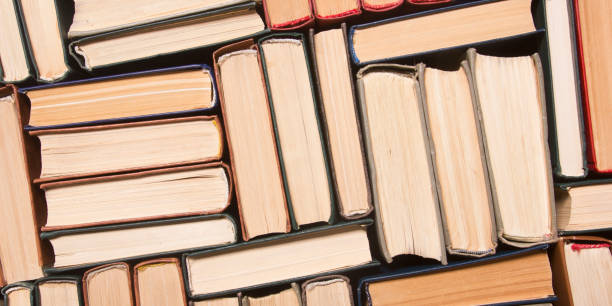 istock Old and used hardback books or text books from above. 1207726904