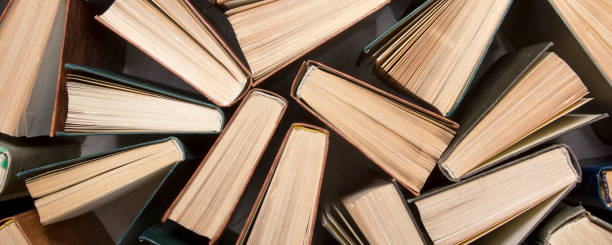 istock Old and used hardback books or text books from above. 1207727487