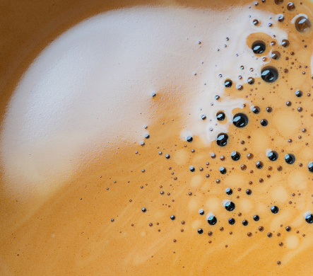 foam crema coffee texture macro background on hot coffee, Close-up top view