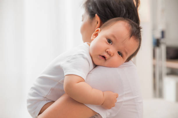 istock Mother holding the baby 1207728048