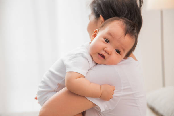 istock Mother holding the baby 1207728078