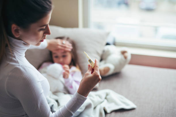 istock Measure Temperature On Sick Child. 1207729755