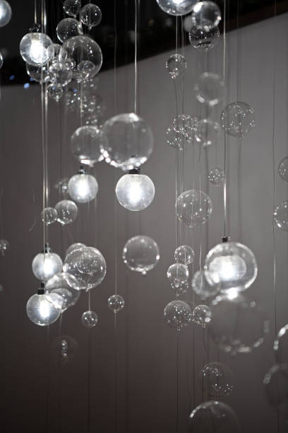 istock Interesting lamps shaped like bubbles hanging from the ceiling. Beautiful decorative lamps. 1207731181