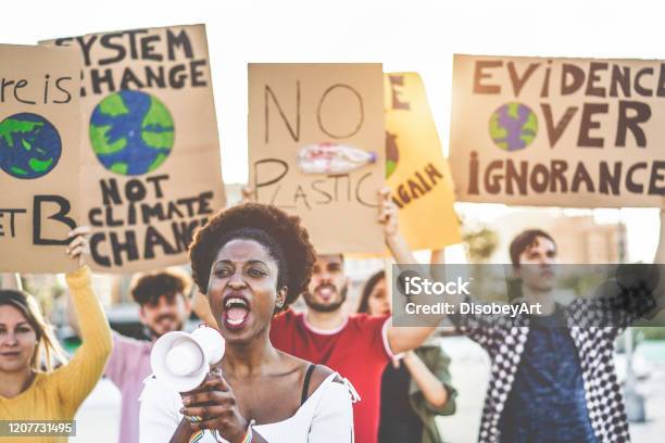 Group Of Young Demonstrators On Road Young People From Different Culture And Races Fight For Plastic Pollution And Climate Change Global Warming And Enviroment Concept Focus On African Girl Face Stock Photo - Download Image Now
