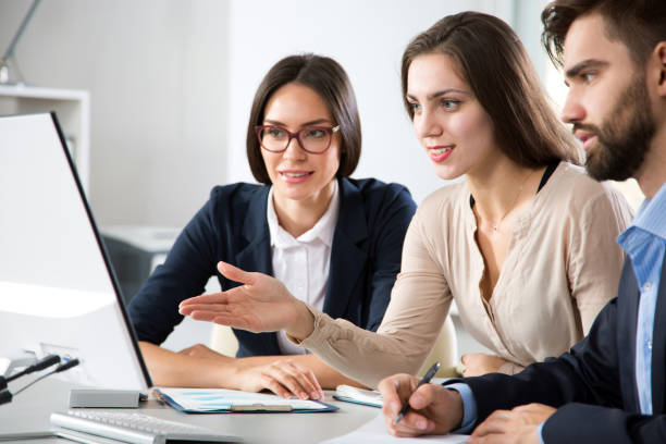 istock Businesswoman explains to colleagues a new project 1207732387