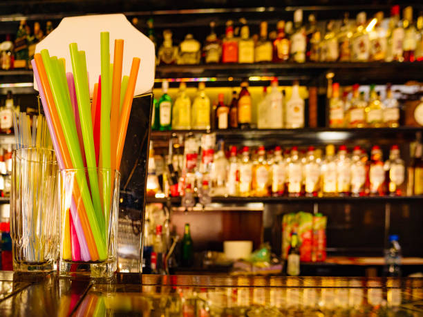istock Bar counter and blurred background with alcohol bottles. 1207733630